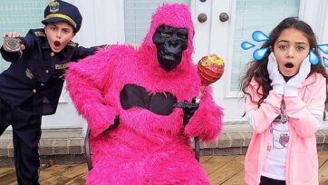 Little Police Officer Meets Pink Gorilla Candy Surprise Adventure